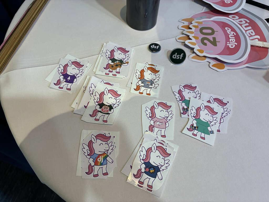 Close-up of Django pony stickers on a table, with 8 different designs